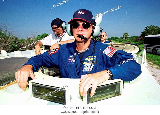 07/18/2001 -- STS-105 Pilot Rick Sturckow is ready to take the wheel of the M-113 armored personnel carrier that is part of emergency egress training at the pad