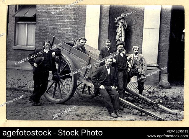 Golf club workers, Trafford Park, Manchester, with a cart