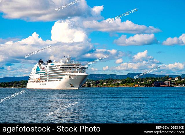 Oslo, Ostlandet / Norway - 2019/09/02: Panoramic view of Oslofjord harbor from Hovedoya island with MV Seabourn Ovation cruise ship by Seabourn Cruise Line in...