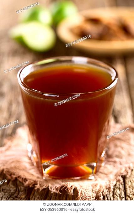 Fresh homemade Aguapanela, Agua de Panela or Aguadulce, a popular Latin American sweet drink made of panela unrefined whole cane sugar boiled in water