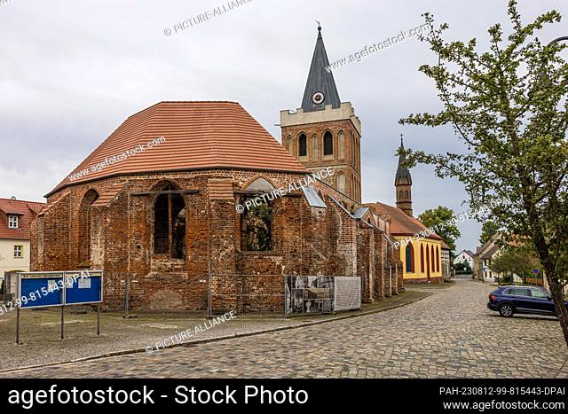 12 August 2023, Brandenburg, Lieberose: The church of Lieberose stands on the market square of the Spreewald village. A mother from Bosnia with four children...