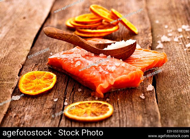 Raw salmon on a wooden table