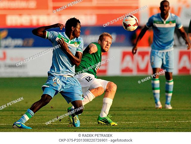 Baumit Jablonec?s Karel Pitak, right, fights for the ball with Betis Sevilla?s Nosa Igiebor, left, during their soccer play-off European League match in...