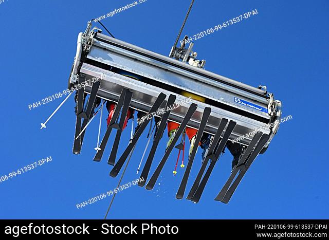 06 January 2022, Hessen, Willingen: Skiers sit in a six-person lift. Fresh snow has caused a big rush on the previously prepared ski slopes in Willingen