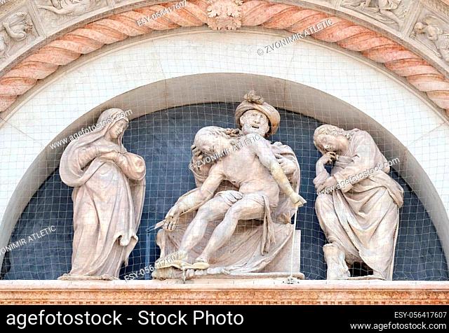Deposition from the Cross, Virgin Mary and St. John, Lunette of San Petronio Basilica by Ercole Seccadenari in Bologna, Italy