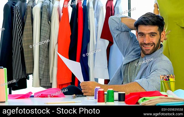 Fashion designer room, the tailor designs a new collection of clothes in his office