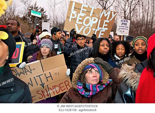 Superior Township, Michigan - About a thousand people marched to the home of Michigan Governor Rick Snyder to protest Michigan's emergency financial manager law...