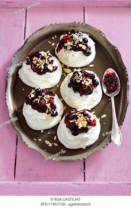 Meringues with whipped cream and berry compote