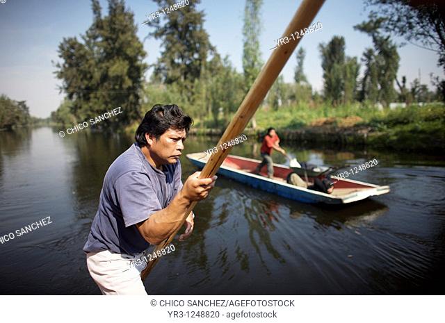 A man uses a boat through a canal in San Gregorio Atlapulco village in Xochimilco, southern Mexico City. The water canals and gardens in Xochimilco was once...