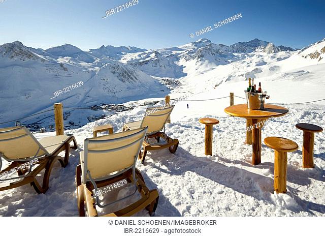 Champagne bottle in a bar, snow-covered mountain landscape, Tignes, Val d'Isere, Savoie, Alps, France, Europe