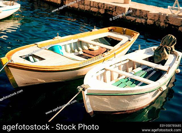 The old town of Perast on the shore of Kotor Bay, Montenegro. The ancient architecture of the Adriatic and the Balkans. Boats and yachts on the dock