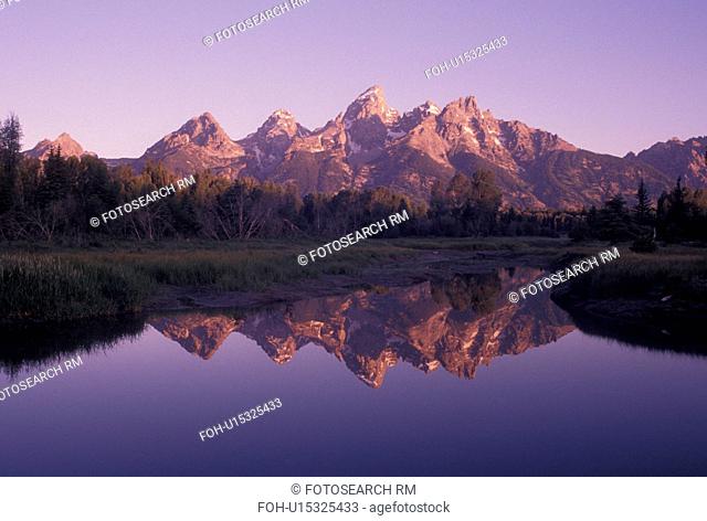 Grand Teton National Park, Snake River, Jackson Hole, WY, Wyoming, Scenic view of the Grand Teton Mountains reflecting in the calm waters of the Snake River at...