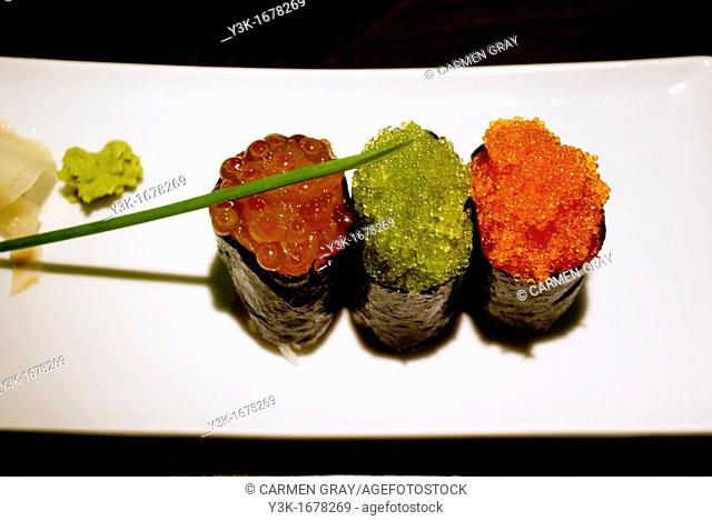 Three makis of caviar and seaweed