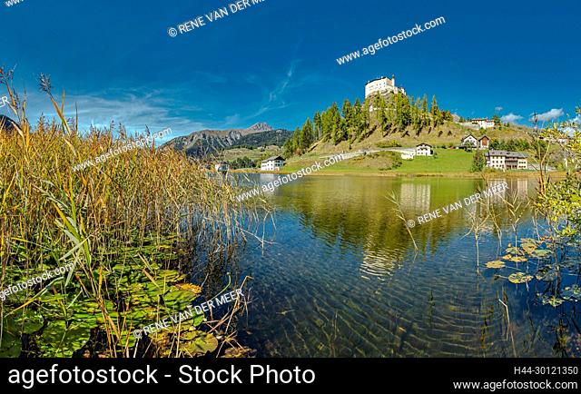 Tarasp castle with the lake Lai da Tarasp