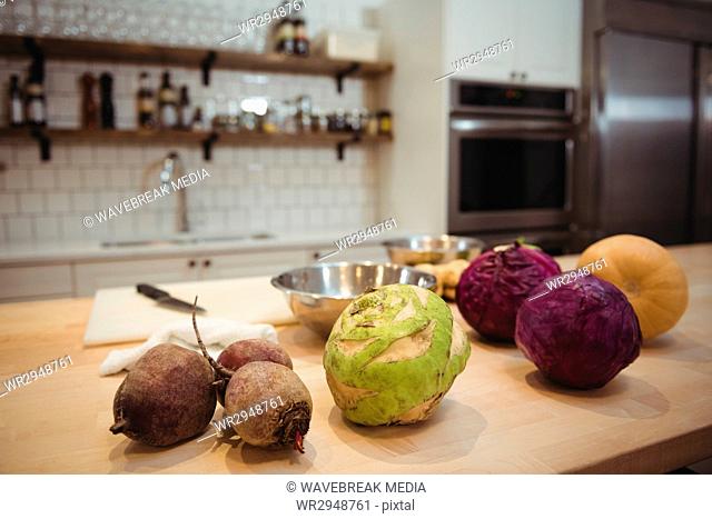 Fresh vegetables on counter in commercial kitchen