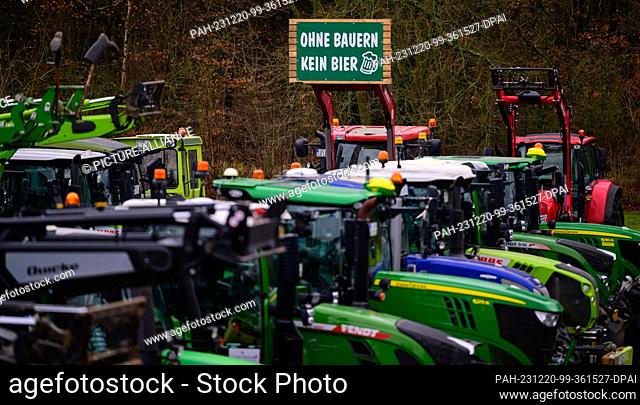 20 December 2023, Lower Saxony, Uelzen: Tractors stand together after a protest action. The reason for this is the German government's plans to abolish the...