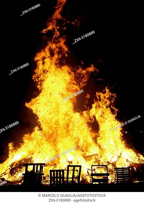 Bonfire of St. John’s Night –nit de Sant Joan- to celebrate Summer Solstice arrival at Olost village. Lluçanès region, Barcelona province, Catalonia, Spain