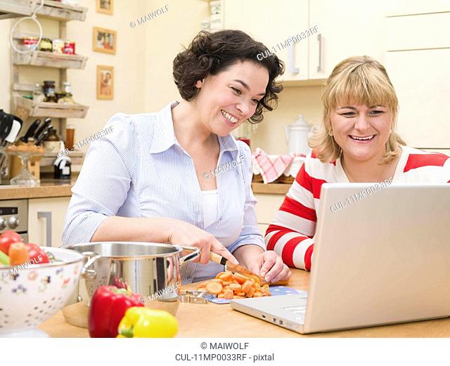 Two women cooking