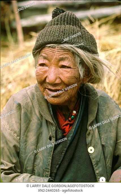 Very old woman, still working for her village. Paro Valley, Bhutan