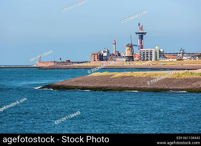 Seascape harbor Dutch city Vlissingen at Westerschelde with lighthouse and houses