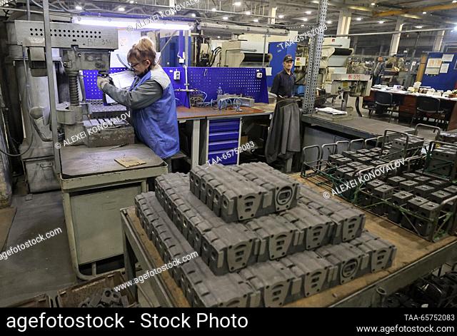RUSSIA, ZAPOROZHYE REGION - DECEMBER 14, 2023: Employees are at work at the MDK-Gidrosila plant, a producer of hydraulic cylinders for tractors and agricultural...