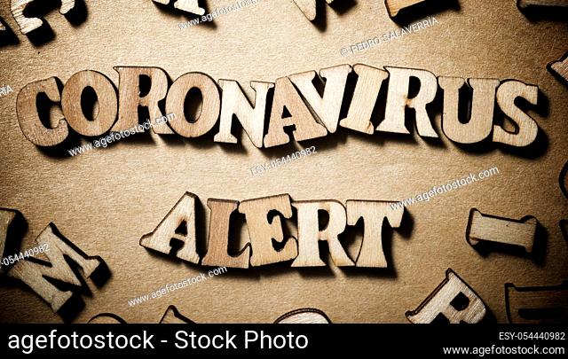 Coronavirus Alert sentence on a brown paper