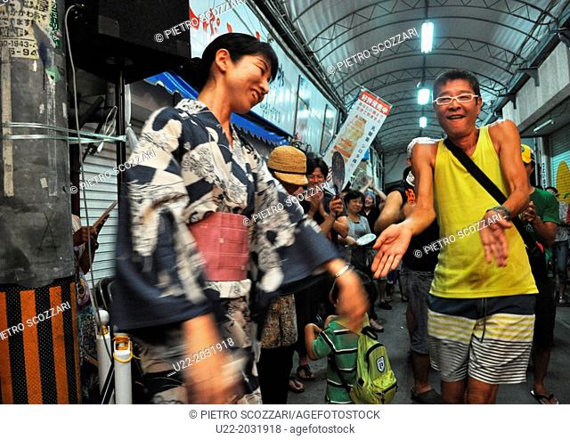 Naha, Okinawa, Japan, people dancing during a music party at Sakaemachi Market