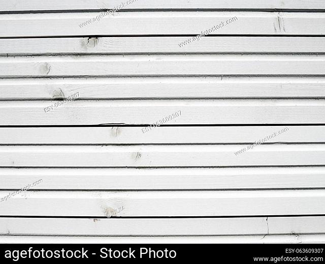 White colored old vintage wood with horizontal boards. Grunge wooden background. Shabby chic France Provence style. White boards as background