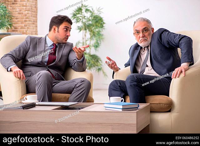 Two businessmen discussing project in the office