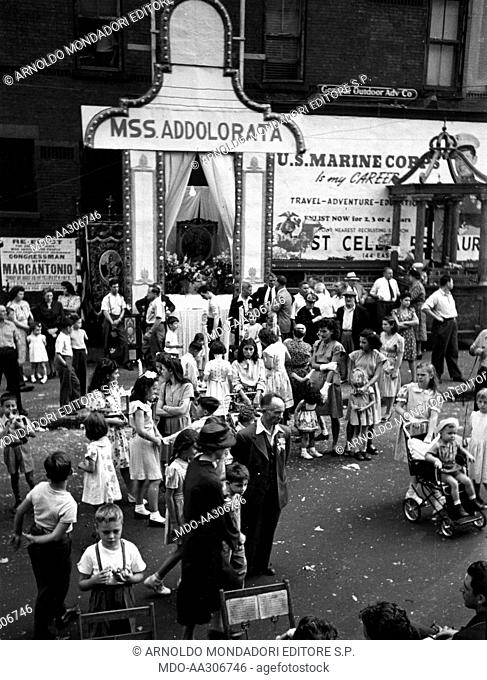 Catholic procession in New York. In Manhattan's Little Italy neighbourhood, Italian-American adults and children preparing for the Procession of the Blessed...