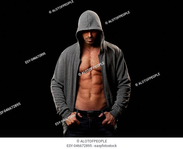 Muscular man in gray hoodie