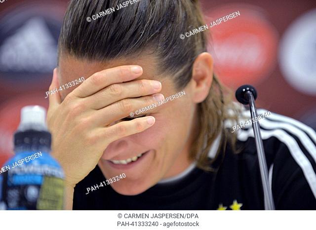 Germany's goalkeeper Nadine Angerer smiles during the UEFA press conference at the Women's EURO in the press from of Friends Arena in Solnar,  Sweden