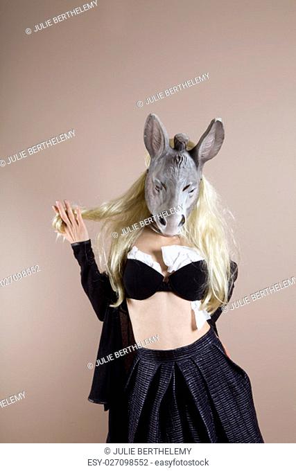 Because laughter is the best medicine, laugh at the stereotypes of the blonde.Blond Donkey woman wearing a black bra with toilet paper inside