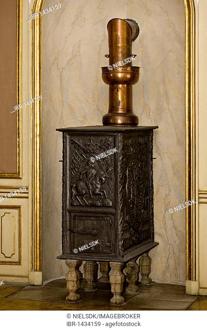 Old woodburning stove with copper vent pipe
