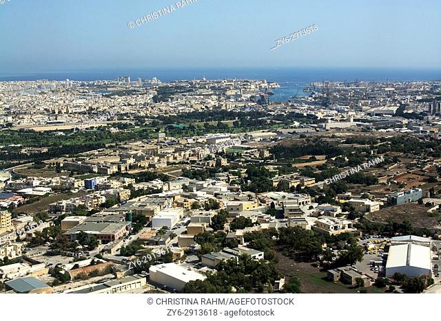 Takeoff with view east over Valletta and St Julian's area in Malta