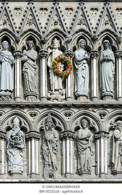 West facade on Nidaros Cathedral in Trondheim, detail with statues of saints, King Olaf II Haraldsson is decorated with a wreath