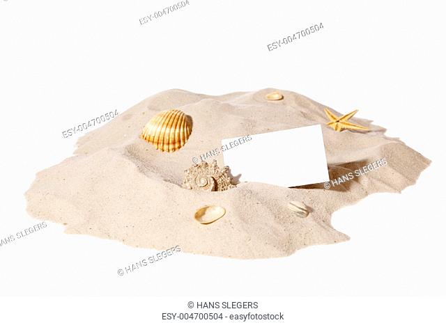 beach concept with pile of sand and a blank card