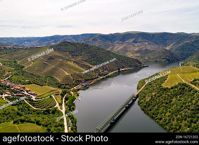 Douro railway bridge drone aerial view of river wine region in Ferradosa, Portugal