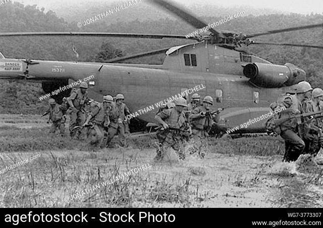 VIETNAM Near Phu Bai -- 18 Nov 1967 -- US Marines exit their transportation, a CH-53A Sea Stallion with Marine Heavy Helicopter Squadron 463