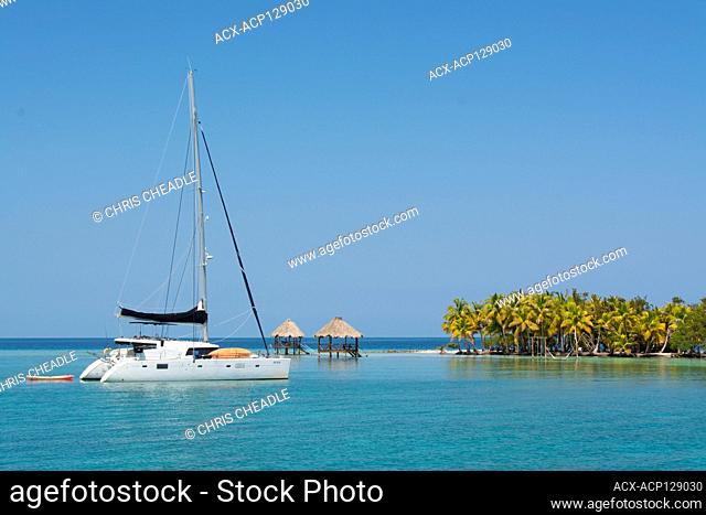 Cruising catamaran at North Long Coco Plum Caye, Belize