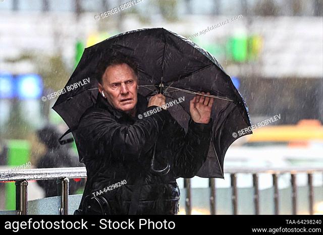 RUSSIA, MOSCOW - NOVEMBER 2, 2023: A man holding an umbrella walks in the rain in late autumn. Sergei Bobylev/TASS