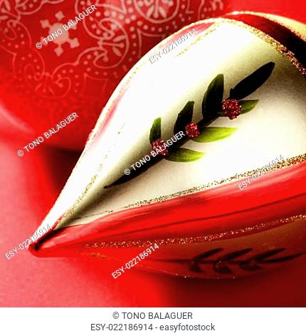 Golden christmas macro decoration, red background