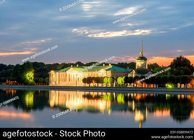 View of the Kuskovo park at sunset. Kuskovo Palace and reflection in pond. Kuskovo was the summer country house and estate of the Sheremetev family