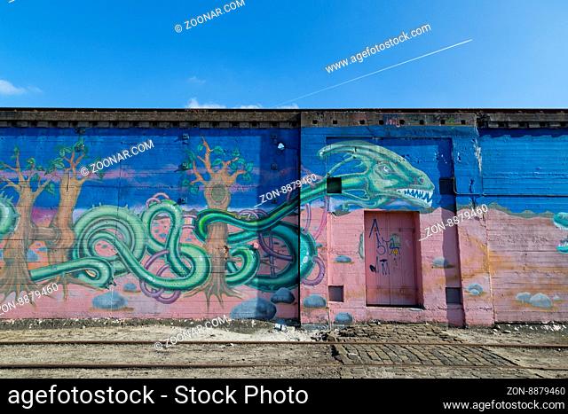 Copenhagen, Denmark - March 17, 2016: Graffiti mural in abandoned industrial district