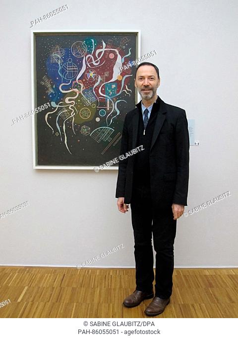 Museum director and curator Guy Tosatto poses in front of the Kandisky image 'Mouvement I' at the art museum in Grenoble, France, 22 November 2016