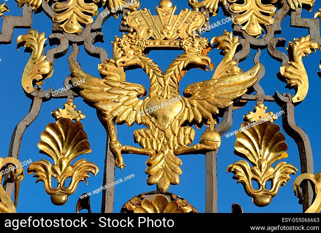 Fragment of Catherine palace fence in Tsarskoye Selo with golden double-headed eagle, suburb of St.Petersburg, Russia