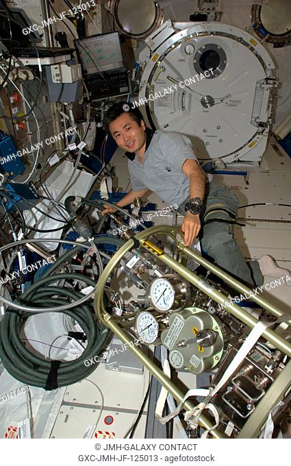 Japan Aerospace Exploration Agency (JAXA) astronaut Koichi Wakata, Expedition 20 flight engineer, works with the Fluid Control Pump Assembly (FCPA) in the Kibo...