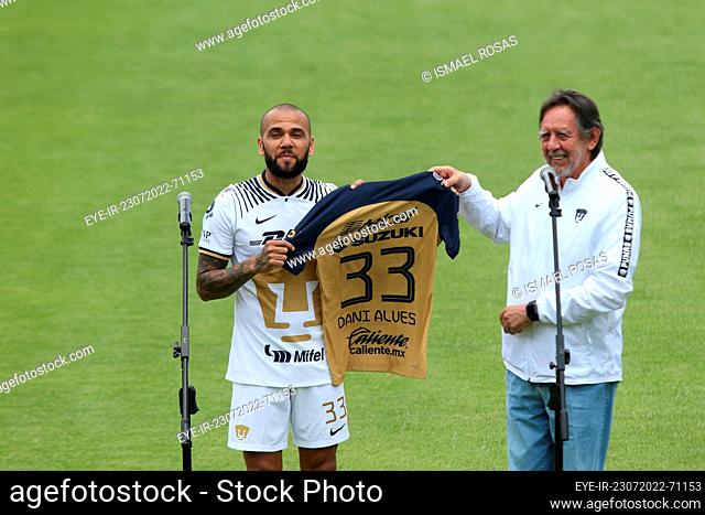 July 23, 2022, Mexico City, Mexico: Brazilian Dani Alves receives his official Pumas' jersey from club president Leopoldo Silva during his presentation as a new...
