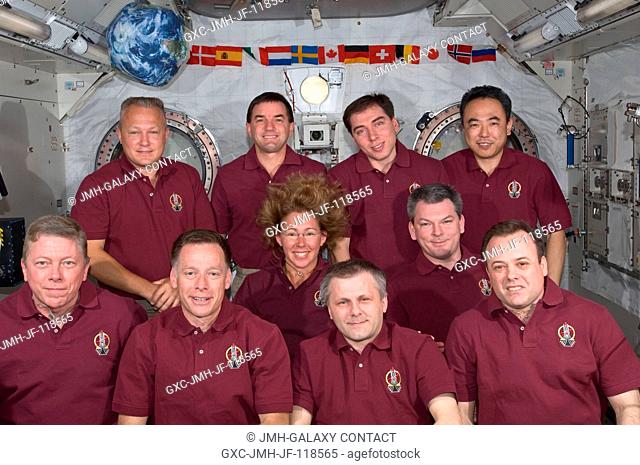 The Expedition 28 crew and the STS-135 Atlantis astronauts take a break from a busy day in space to pose for a portrait aboard the orbiting complex's Kibo...