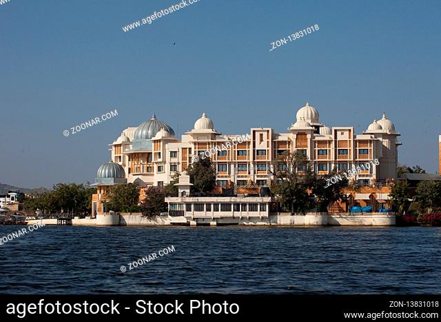 UDAIPUR, INDIA - NOVEMBER 23, 2012: City Palace in Udaipur at sunset City Palace on Lake Pichola